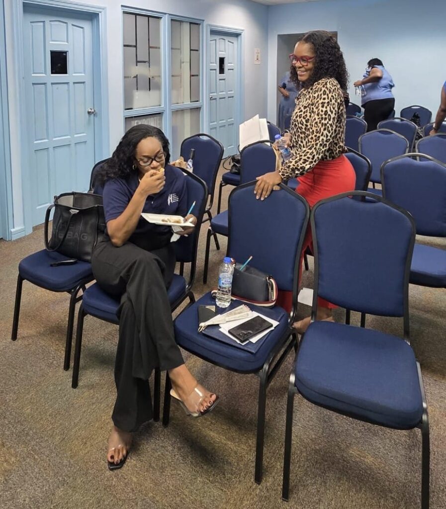 Two HRMAB members chatting over refreshments after the induction ceremony